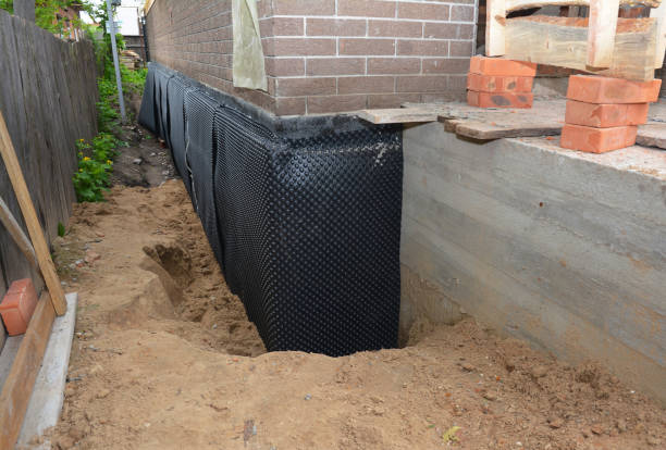Happy homeowners after waterproofing job in Lake Mills